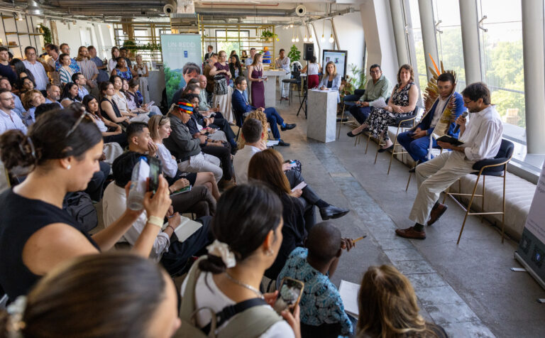 Panel discussion in front of an audience.